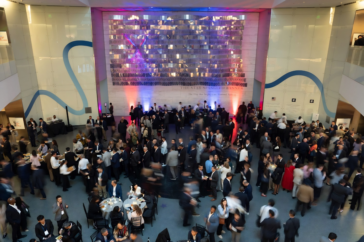 International delegates networking at the SelectUSA Investment Summit 2026 in a large conference hall